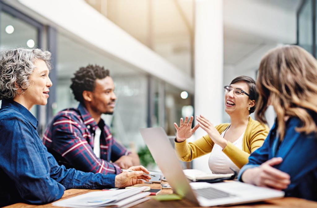 Group of varying age, race, and gender, meeting professionally