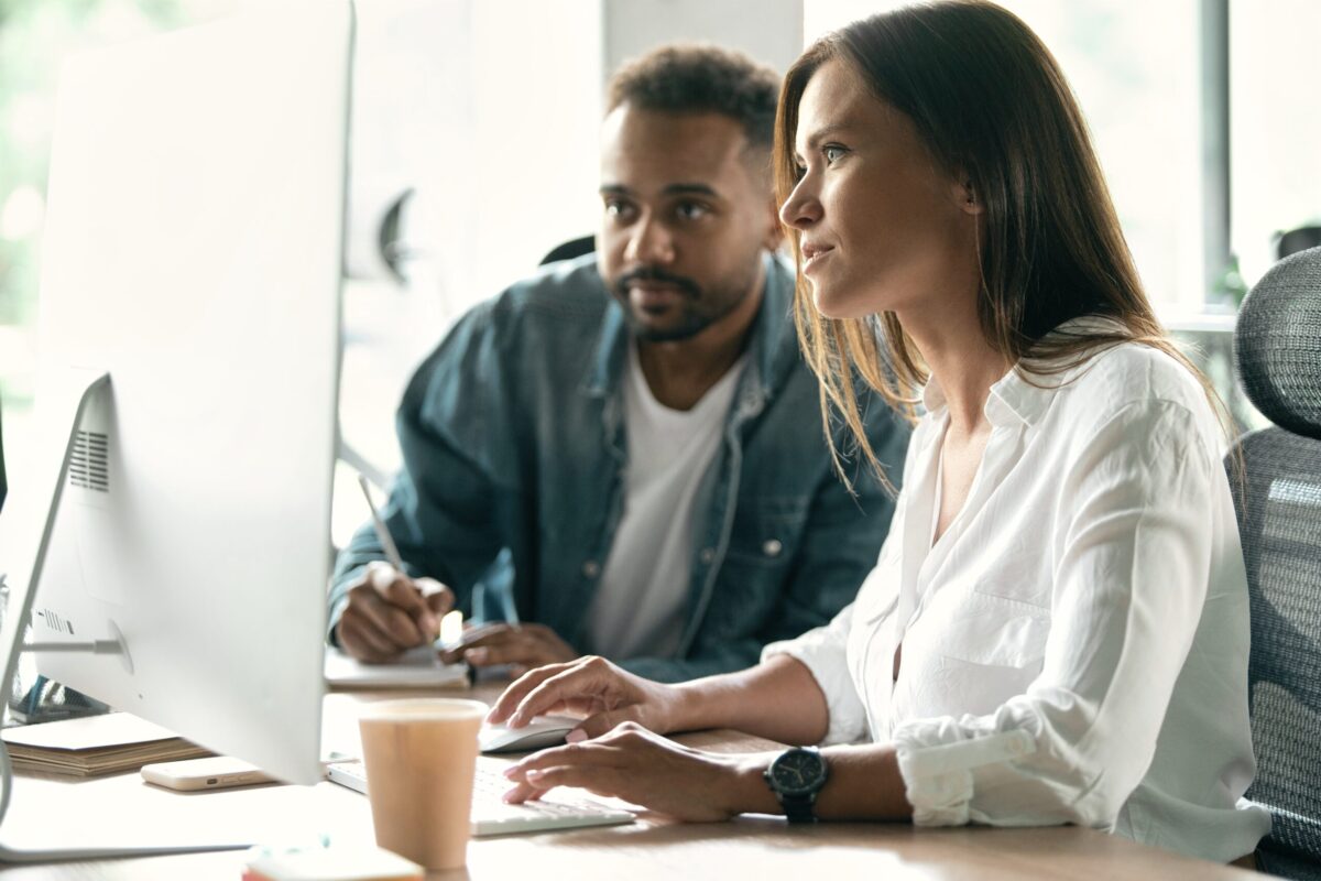 recruiters working at desktop in office